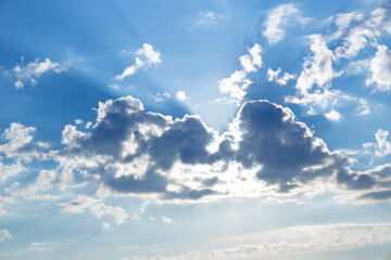 Fototapeta premium White clouds on blue dramatic sky Sunbeam, background look abstract nature.