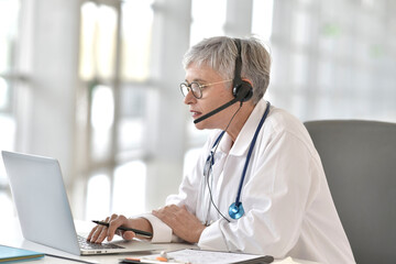 Practitioner in office having virtual consultation online with patient