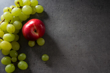 Colorful fruit frame on dark background. Summer fruits top view photo with copy space. 