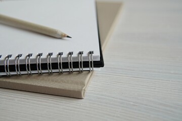 Empty spiral notebook and pencil, sketch book close up, feminine styled stock photo for blog post, empty space for text,  writing, art, design concept.