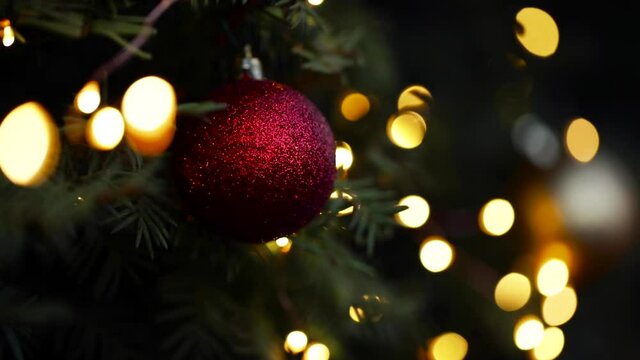dark XMAS background video with Christmas balls and bokeh from lights