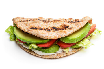 Folded wholemeal flatbread with vegetables isolated on white