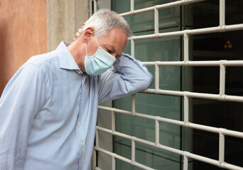 Desperate shop owner in front of his business closed due to Coronavirus pandemic