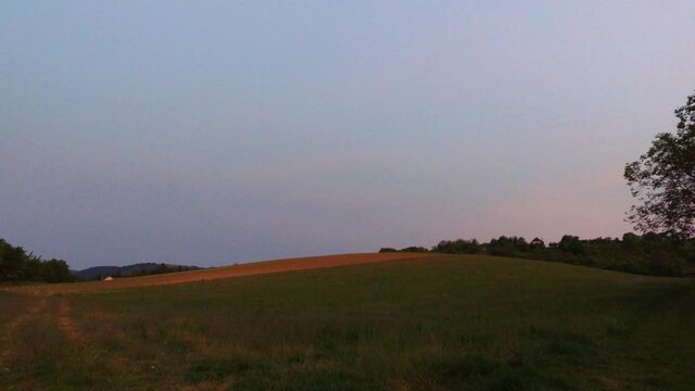 Walking along at dirt road. Nature at sunset. Hand held. Hungary, Europe. 4K
