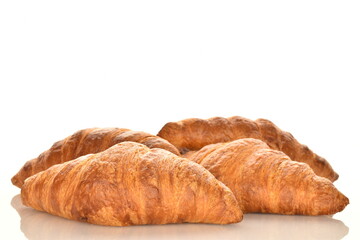 Fragrant homemade croissant, close-up, on a white background.