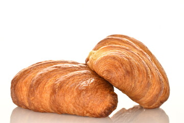 Fragrant homemade croissant, close-up, on a white background.