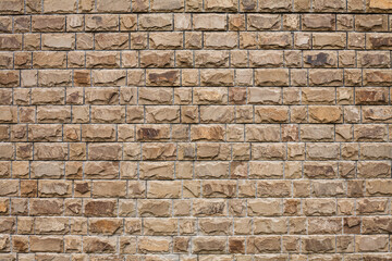 Texture of a stone wall. Part of a building wall. Close-up. Place for text.