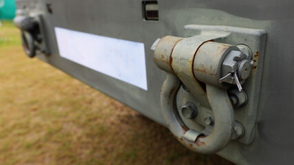 Tow hook on car bumper. Tow hook for military truck. Close focus and select an object