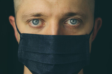 Closeup portrait of a man wearing mask. Quarantine concept