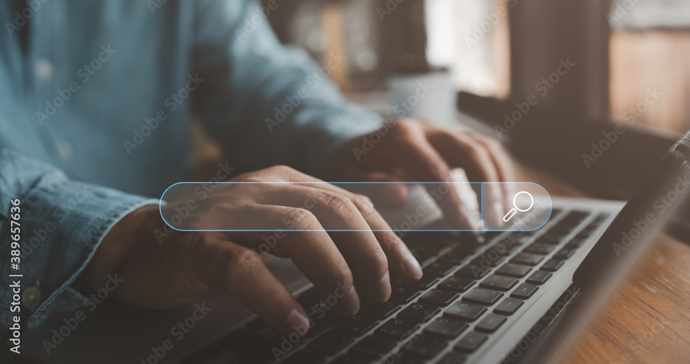 Fototapete Searching Browsing Internet Data Information with blank search bar.Search Engine Optimization SEO Networking Concept.hand of businessman working with computer laptop on desk in office.