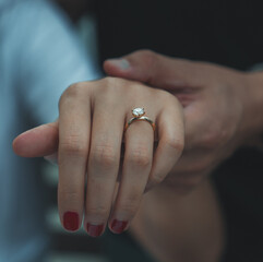wedding rings on hands of bride