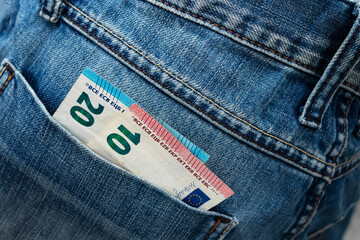 Euro bill in the back pocket of jeans. ThirtyEuro in a denim pocket.