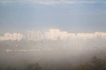 Bright highrise residential buildings in the fog