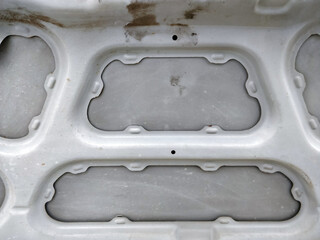 Car bonnet backside having stains.