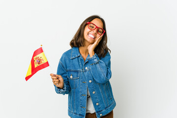 Young spanish woman holding a flag isolated on white background