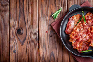 Tasty fried crispy bacon slices