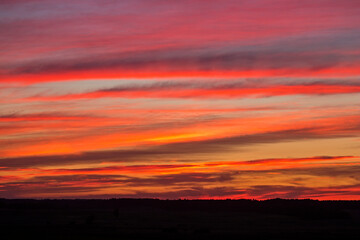 Fototapeta premium Dramatic sky over the fields. Agricultural landscape in eastern Lithuania.