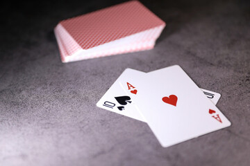 A pair of aces on a deck of playing cards on a table. Online gambling. Gambling addiction	