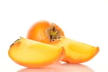 Obraz na płótnie Canvas Ripe juicy organic persimmon, close-up, on a white background.
