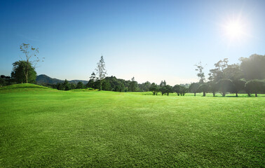 Sunrise golf course with blue sky