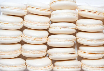 White macaroon background. French dessert.