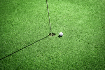 High angle close Up shooting golf Ball and Golf Flag