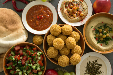 Traditional food of Israel on dark grey background with copy space. Colorful authentic meals top view photo. Healthy eating concept. 