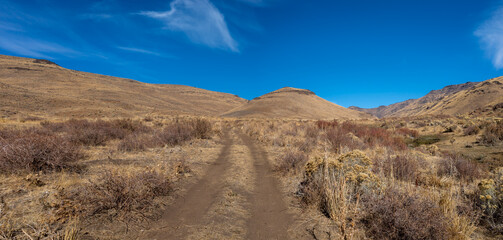 road up a mountain in the Nevada desert.