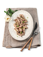 food photography of beef stroganoff side view. Traditional russian meat dish on white background isolated close up