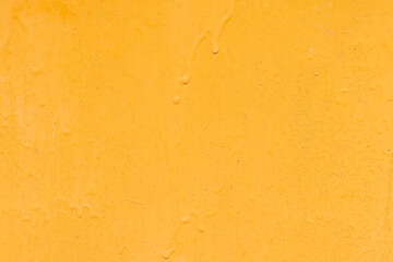Daylight. A piece of rolled metal is painted yellow. Under the influence of sunlight, the paint faded.