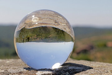 the Tuscan countryside reflected in a crystal ball