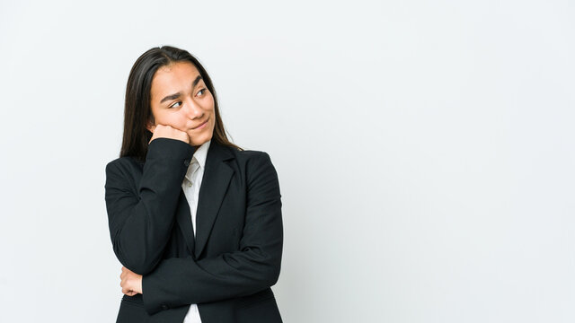 Young Asian Bussines Woman Isolated On White Background Who Feels Sad And Pensive, Looking At Copy Space.