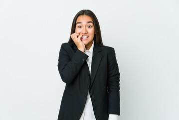 Young asian bussines woman isolated on white background biting fingernails, nervous and very anxious.