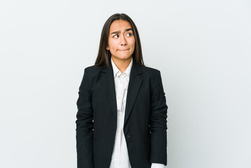 Young asian bussines woman isolated on white background confused, feels doubtful and unsure.