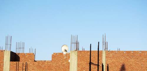 Satellite dish on the roof of the house and blue sky
