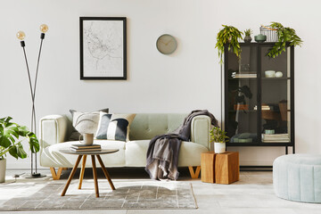 Stylish loft interior with green sofa, design pouf, mock up poster map, furniture, carpet, plants, decoration and elegant accessories. Modern home decor. Template.