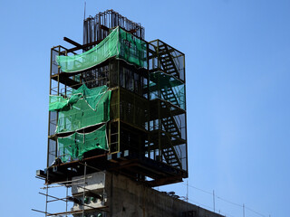 SHAH ALAM, MALAYSIA -AUGUST 6, 2020: Temporary staircase and scaffolding are used in the...