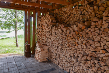 Fototapeta na wymiar traditional woodshed in Belorussian village near Polatsk