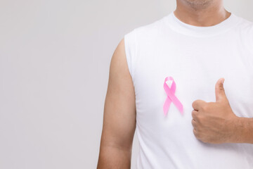 Breast cancer in men concept : Portrait Asian man and pink ribbon the symbol of breast cancer...