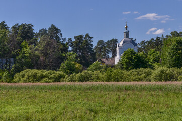 Fototapeta na wymiar Church of the Ascension in Przhevalskoye village in Smolenskoye Poozerye National Park, Russia