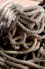 Fototapeta na wymiar light colored old tangled rope