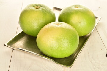 Ripe juicy sweets, close-up, on a white wooden table.