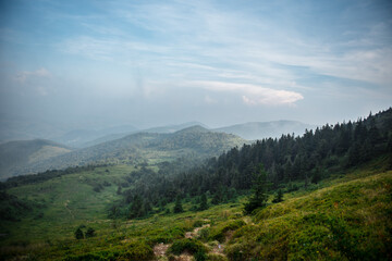 Amazing view of mighty mountains under cloudy sky