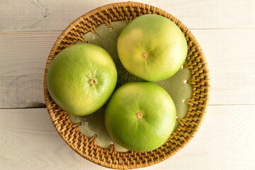 Ripe juicy sweets, close-up, on a white wooden table.