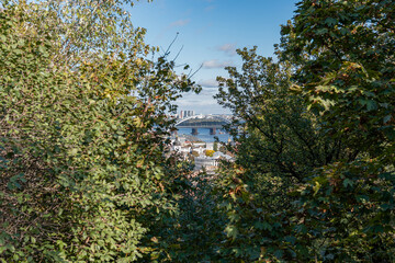Fototapeta na wymiar Kyiv (Kiev), Ukraine - October 8, 2020: Stunning view on the old and ancient tourist area in Kyiv and a bridge over Dnipro river