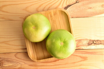 Ripe juicy sweets, close-up, on a wooden table.