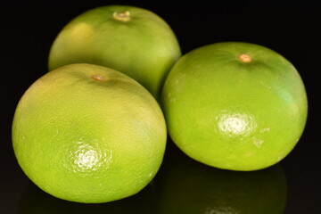 Ripe juicy sweetie, close-up, on a black background.