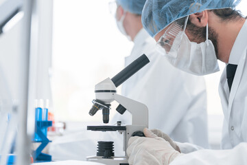 Fototapeta premium close up. a group of scientists working on creating a new vaccine.