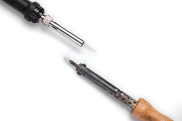 old and new hand-held soldering irons. isolated white