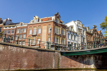 Amsterdam canal and bicycles on a bridge